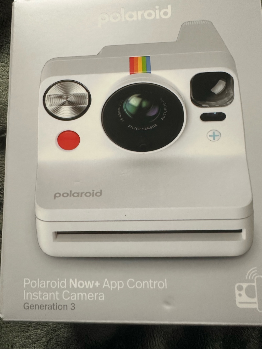 NEW IN BOX.  Polaroid White Instant Camera with Rainbow Accent.  NEVER USED.